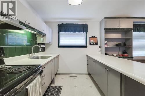 Efficient kitchen design with ample cabinetry and countertop space - 286 Mohawk Road W, Hamilton, ON 