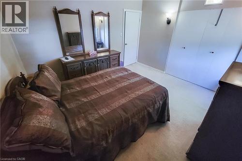 Comfortable primary bedroom with generous closet storage and room for your furnishings - 286 Mohawk Road W, Hamilton, ON 