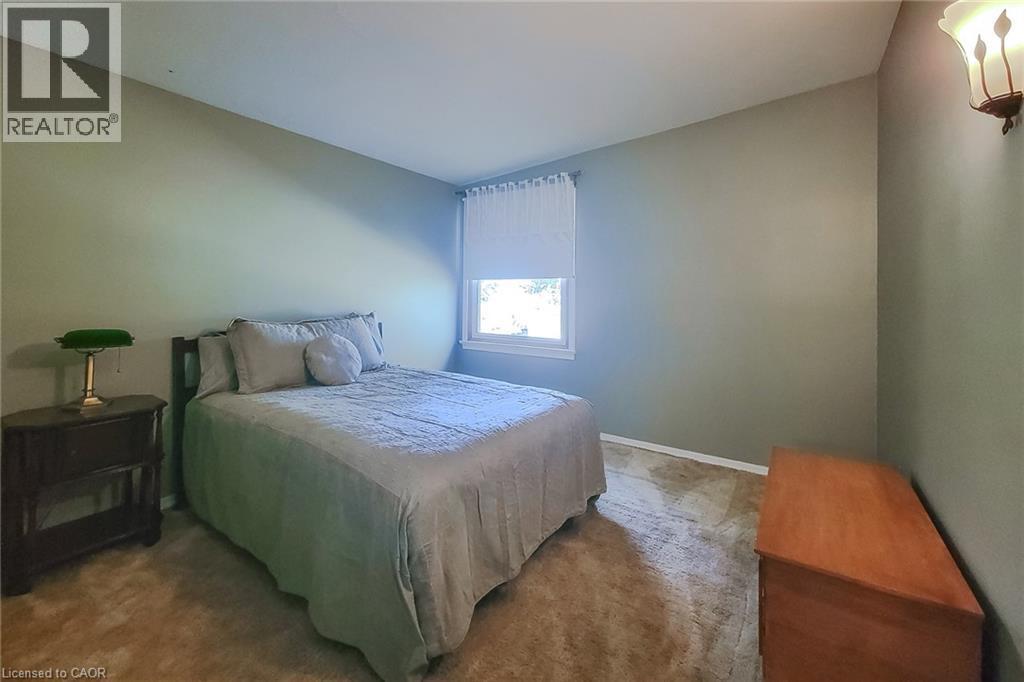 Bright second bedroom offering flexibility for family members or a home office - 286 Mohawk Road W, Hamilton, ON