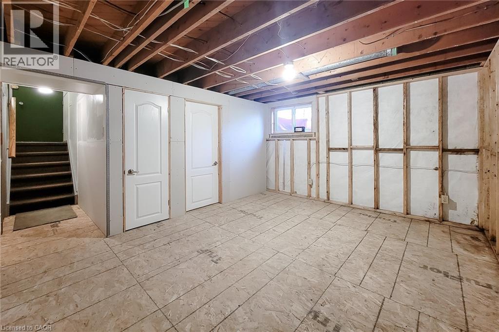 Generous unfinished basement space with existing storage closets and room for future improvements - 286 Mohawk Road W, Hamilton, ON