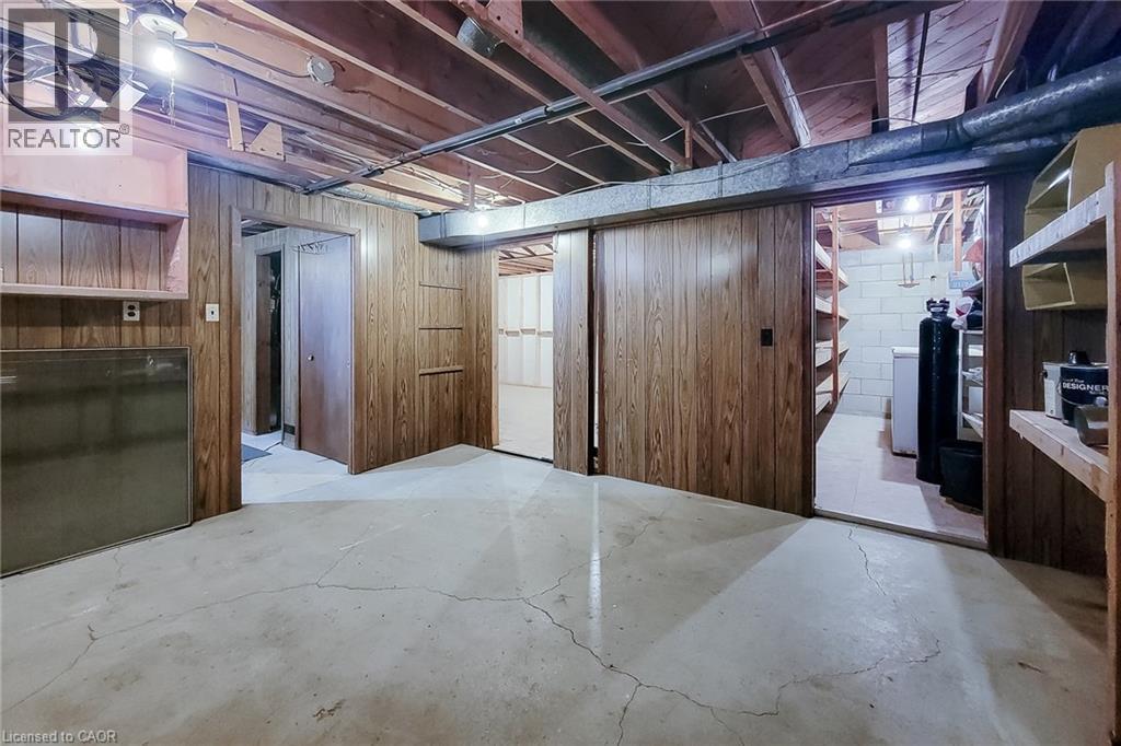 Spacious unfinished basement offering flexible space for storage and future improvements - 286 Mohawk Road W, Hamilton, ON