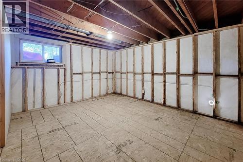 Spacious unfinished basement offering flexible space for storage and future improvements - 286 Mohawk Road W, Hamilton, ON 
