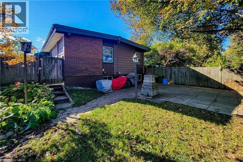 Rear view of the bungalow with backyard access and space to enjoy the outdoors - 286 Mohawk Road W, Hamilton, ON 