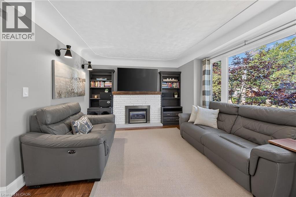 Gas fireplace and engineered hardwood. - 10 Mulock Avenue, Hamilton, ON