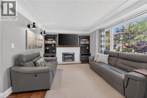 Gas fireplace and engineered hardwood. - 10 Mulock Avenue, Hamilton, ON 