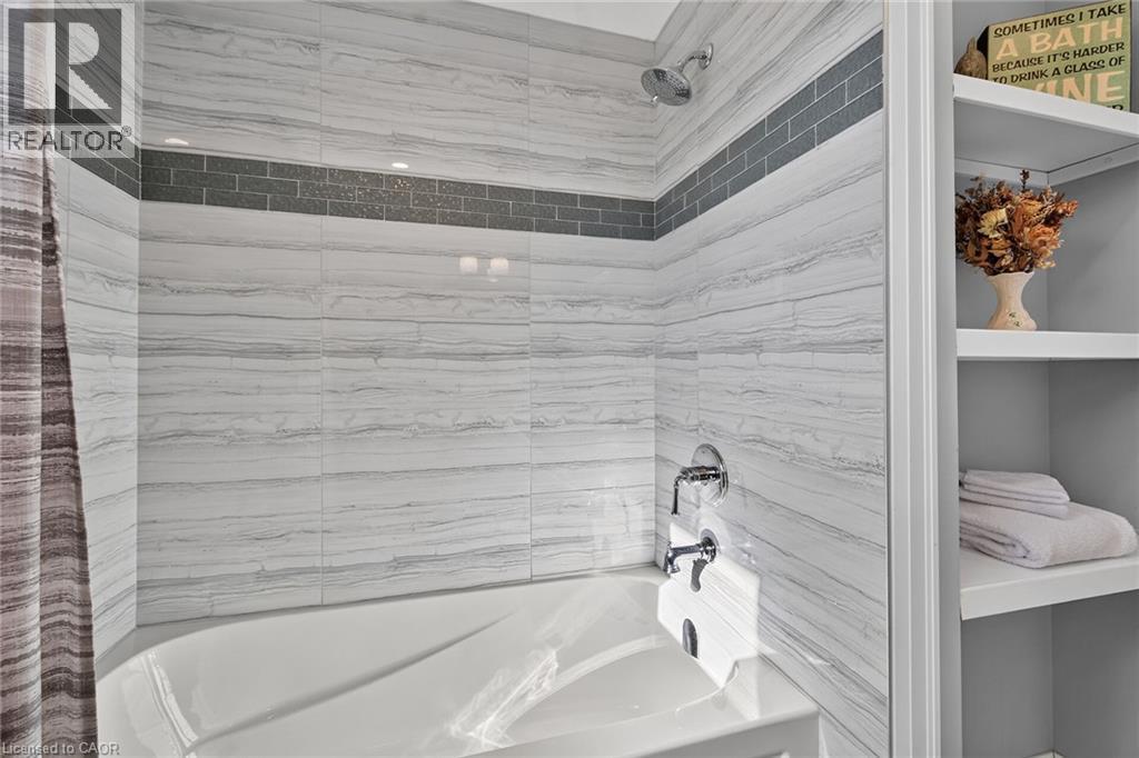 Grey accents and beautiful tile decor. Built in shelving. - 10 Mulock Avenue, Hamilton, ON
