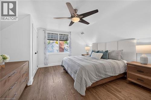 Primary bedroom features refinished original oak flooring and dual closets. - 10 Mulock Avenue, Hamilton, ON 