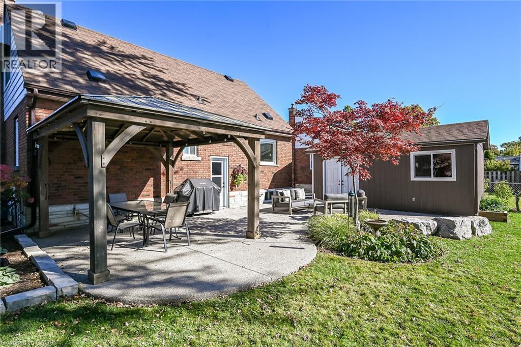 Garage offers access from the backyard with double doors. Gazebo is an ideal shaded dining spot. - 10 Mulock Avenue, Hamilton, ON