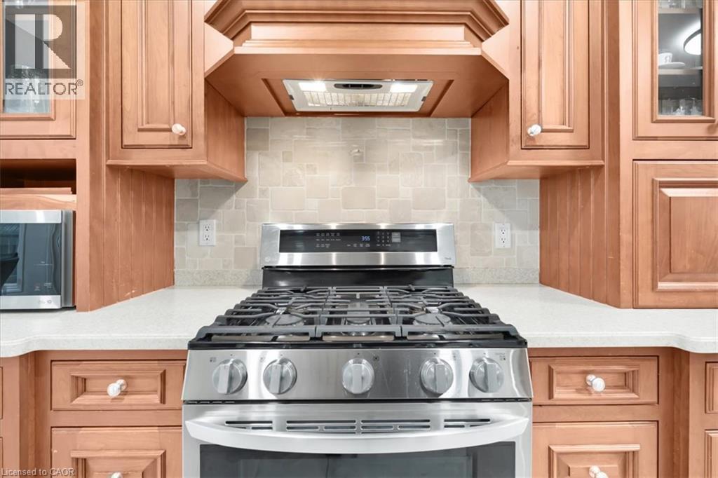 Stainless steel gas range with a coordinating range hood - 31 Berrisfield Crescent, Hamilton, ON