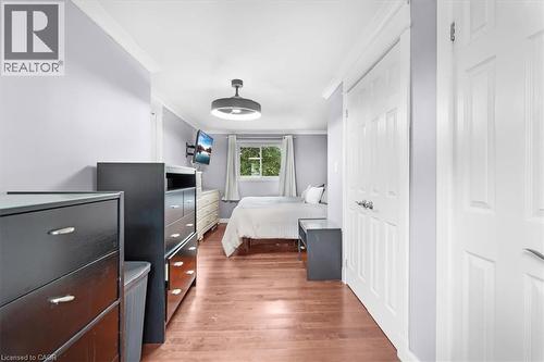 Wood-finish flooring with white trim - 31 Berrisfield Crescent, Hamilton, ON 