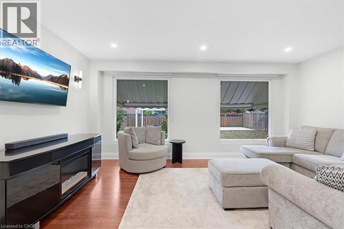 Recessed lighting, wood-finish flooring, and white walls - 31 Berrisfield Crescent, Hamilton, ON 