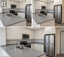 Kitchen featuring light-toned flat-panel cabinetry, stainless steel appliances, neutral solid-surface countertops, dual-basin stainless steel sink with a high-arch faucet, and wood-finish flooring - 