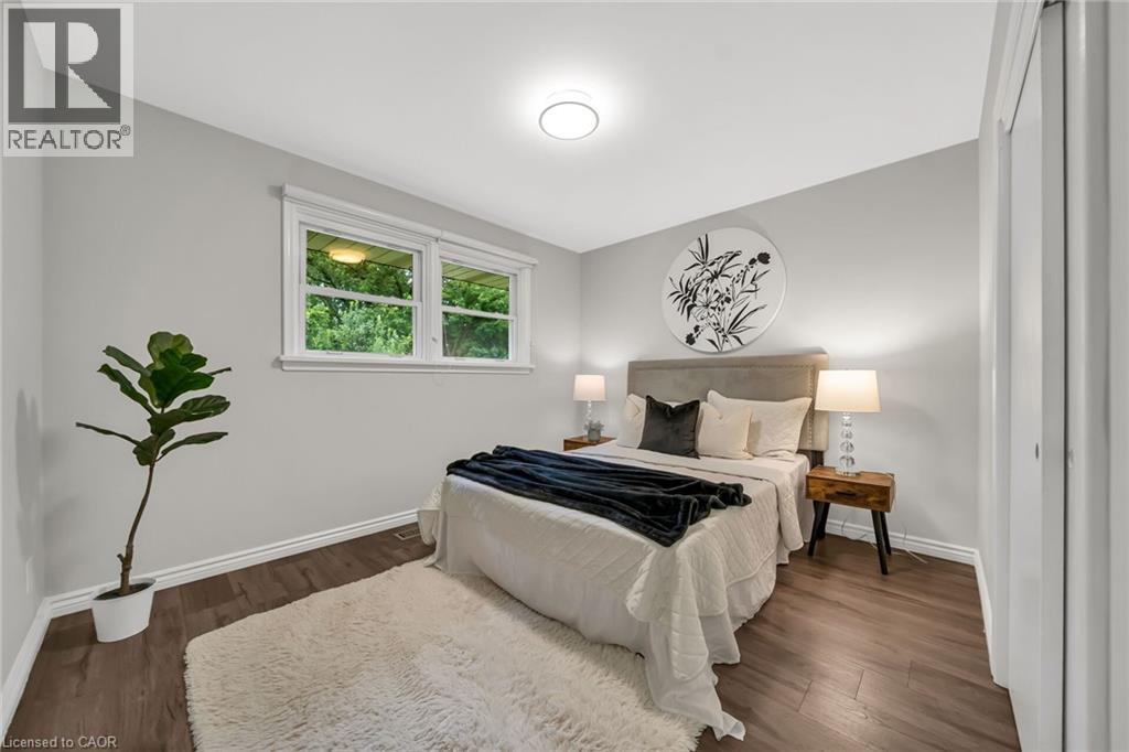 Recessed lighting, wood-finish flooring, and white trim - 284 Cedar Crescent, Cambridge, ON - Indoor Photo Showing Bedroom