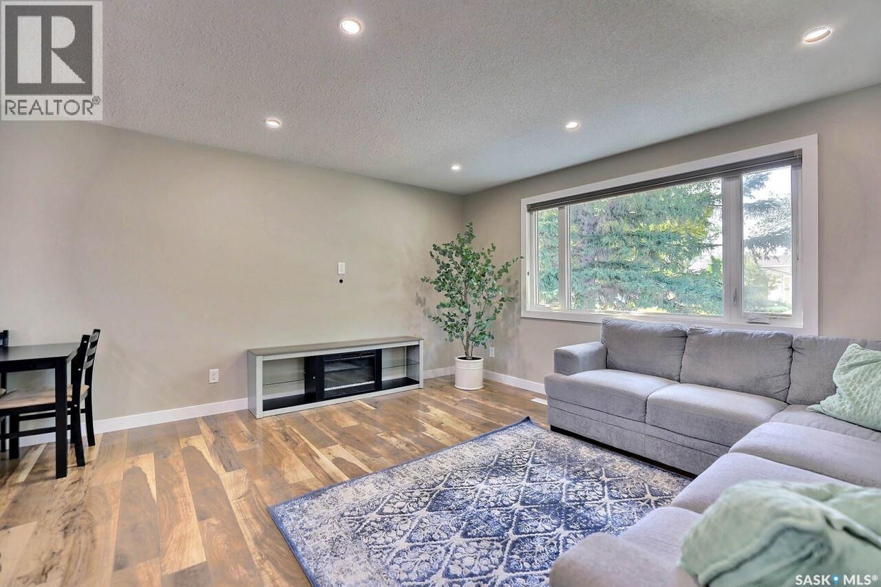 6918 1St Avenue N, Regina, SK - Indoor Photo Showing Living Room With Fireplace