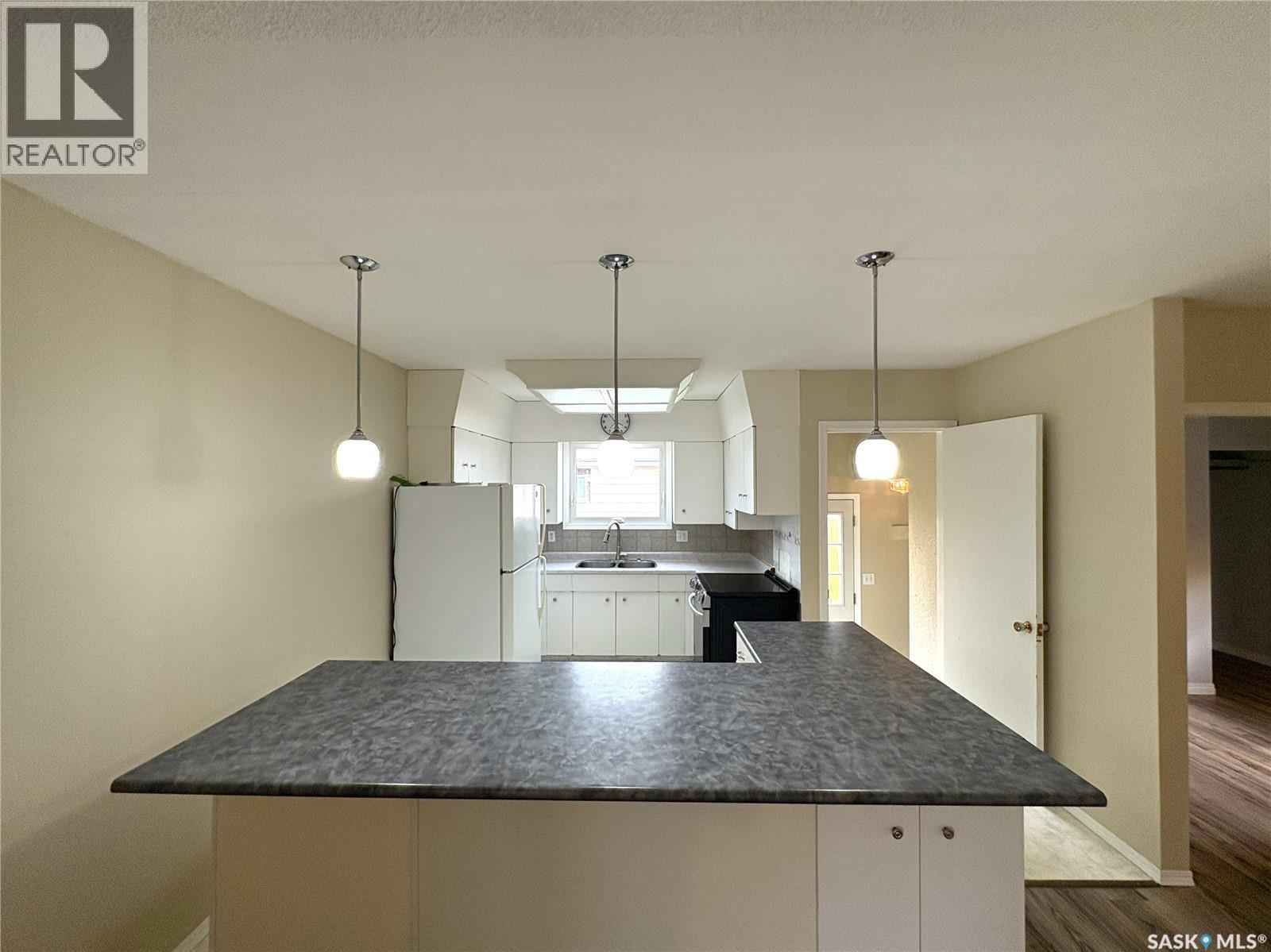 435 2Nd Avenue, Allan, SK - Indoor Photo Showing Kitchen With Double Sink