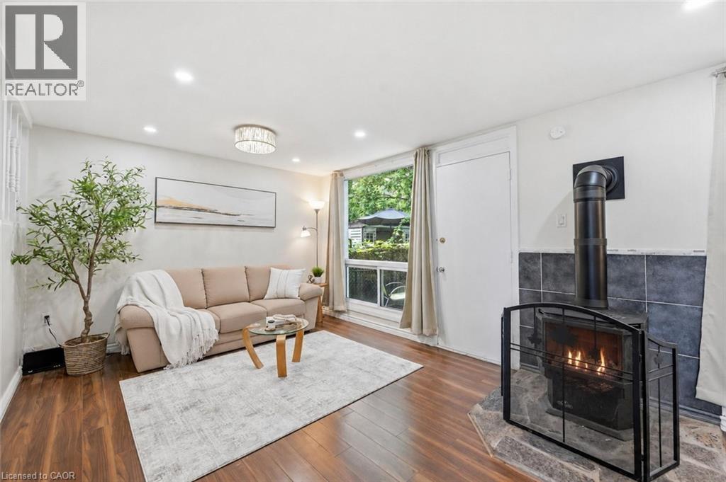 25 Britten Close Unit# B52, Hamilton, ON - Indoor Photo Showing Living Room With Fireplace