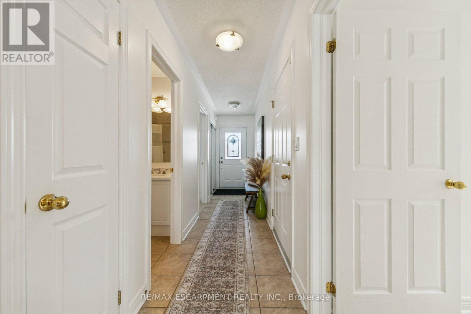 Hallway looking towards front door - 245 Centennial Forest Drive, Milton, ON - Indoor Photo Showing Other Room