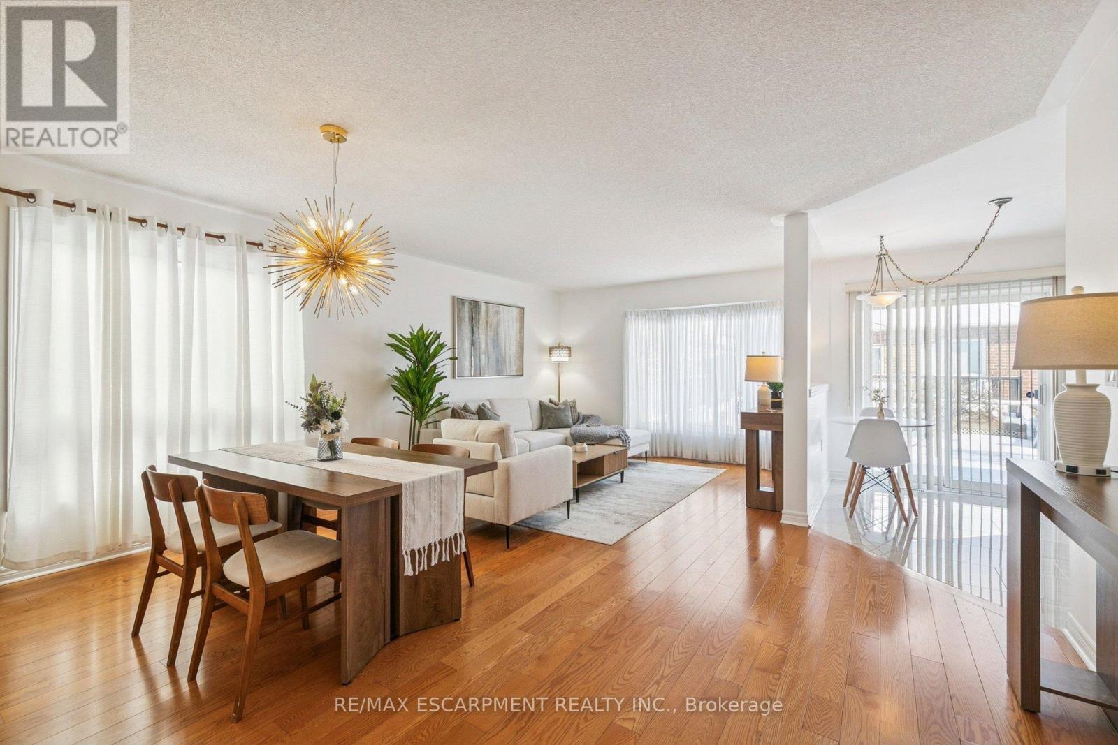 Open concept dining and living area - 245 Centennial Forest Drive, Milton, ON - Indoor Photo Showing Dining Room