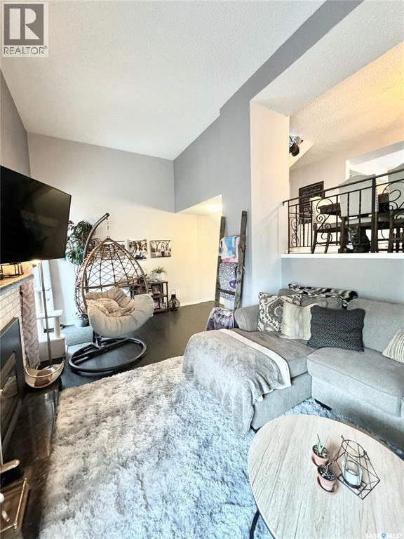 1908 3Rd Avenue E, Prince Albert, SK - Indoor Photo Showing Living Room With Fireplace