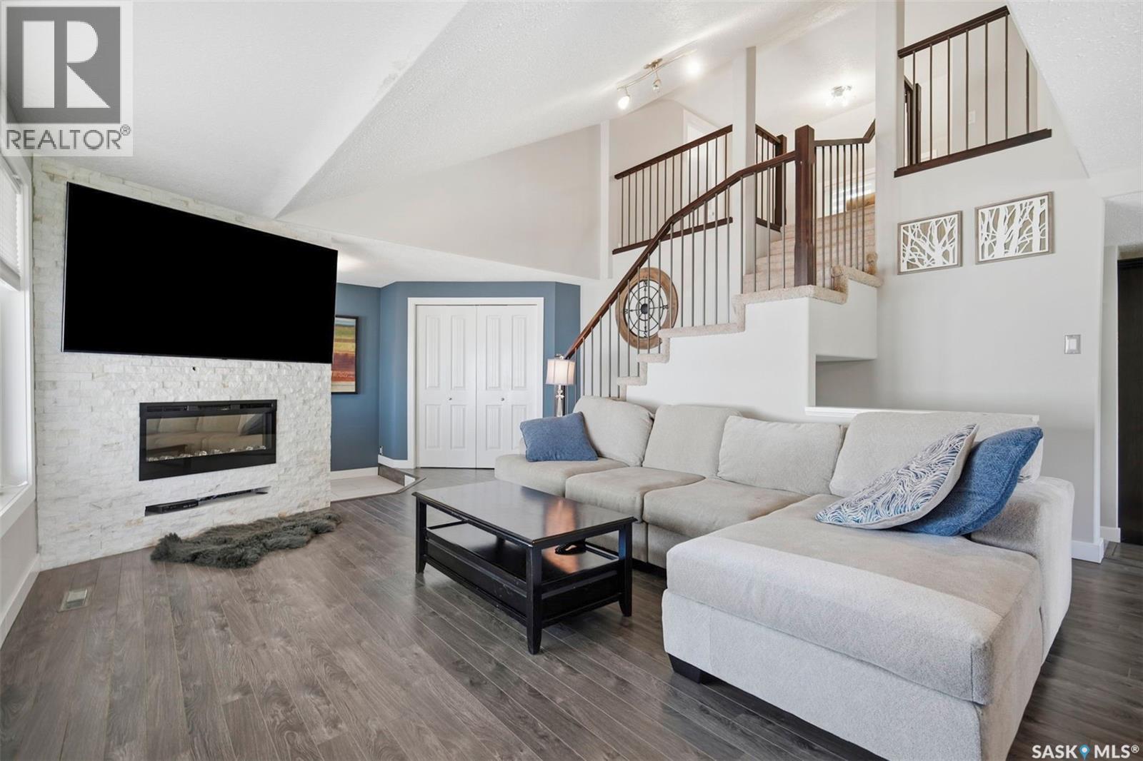 312 3Rd Street W, Warman, SK - Indoor Photo Showing Living Room With Fireplace