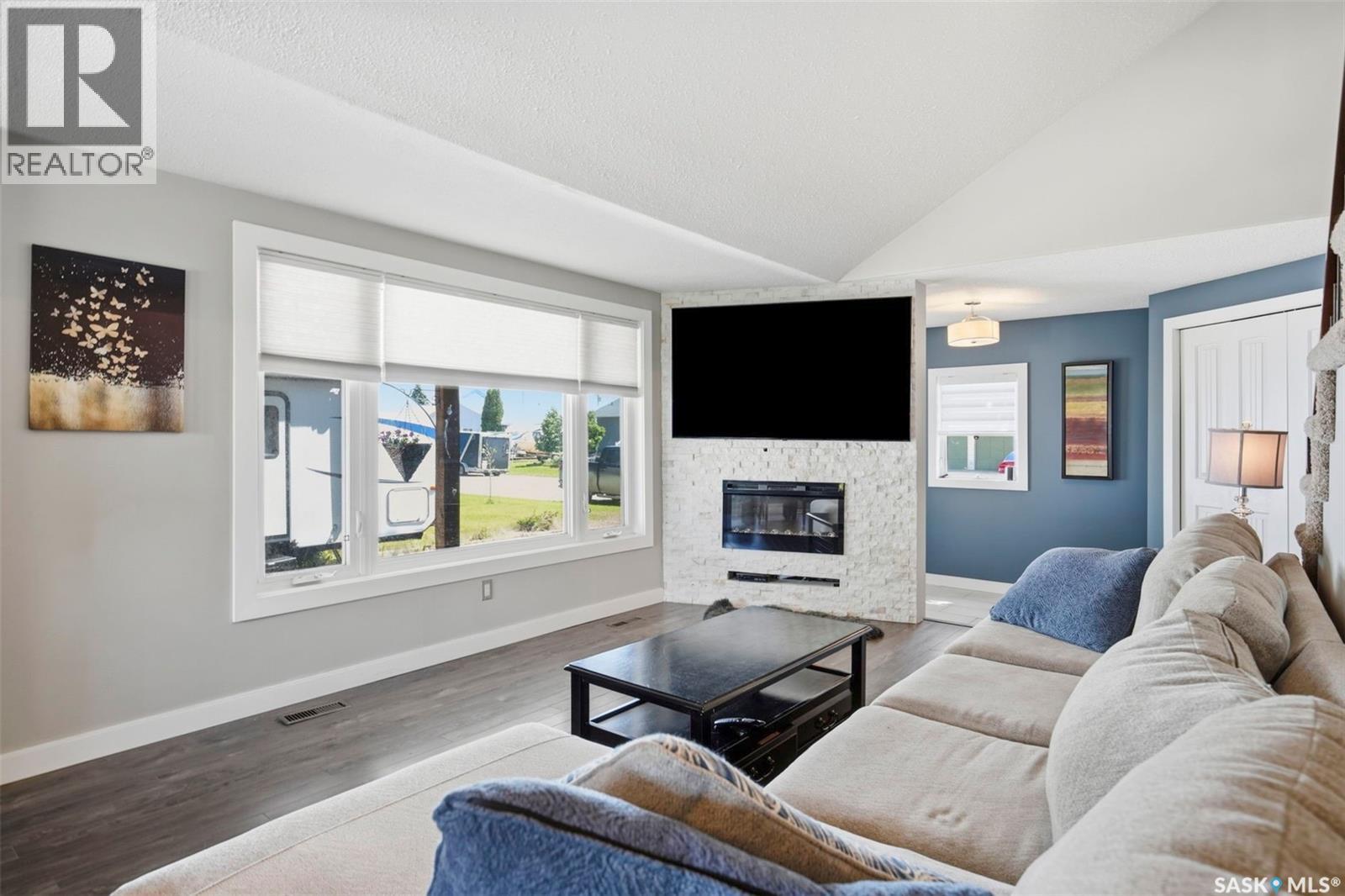312 3Rd Street W, Warman, SK - Indoor Photo Showing Living Room With Fireplace