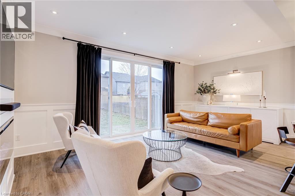 Living room with a wainscoted wall, ornamental molding, recessed lighting, a decorative wall, and light wood finished floors - 239 Cranbrook Street, Kitchener, ON - Indoor Photo Showing Living Room