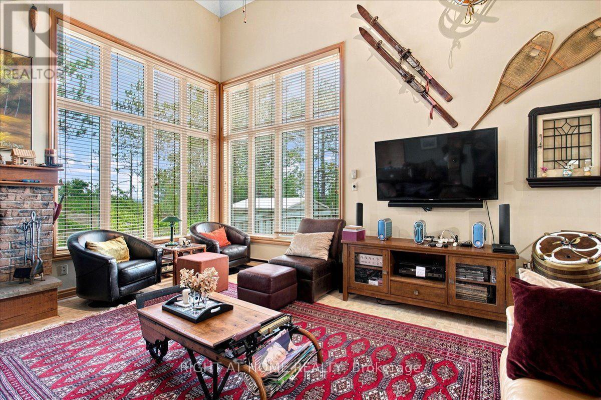 12 James Street, Tiny, ON - Indoor Photo Showing Living Room With Fireplace