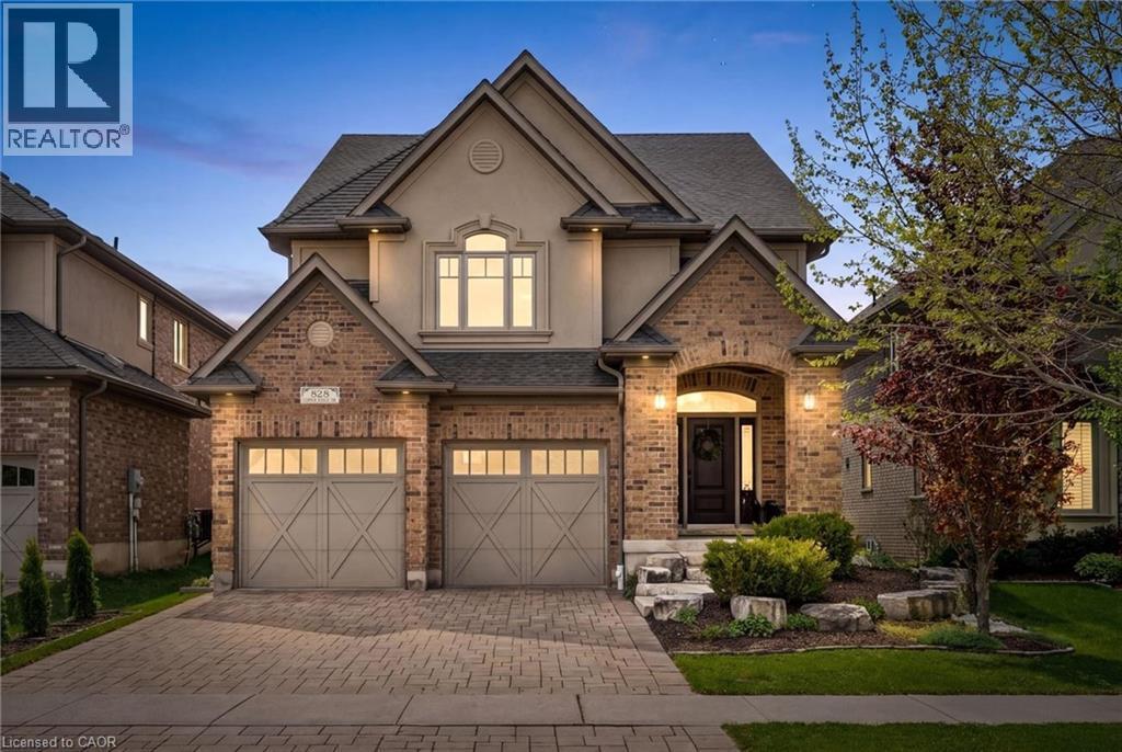 Traditional-style facade featuring brick and stucco elements. - 828 Copper Ridge Drive, Waterloo, ON - Outdoor