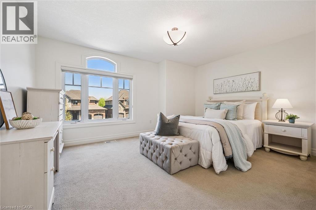 Bright bedroom with large window. - 828 Copper Ridge Drive, Waterloo, ON - Indoor Photo Showing Bedroom
