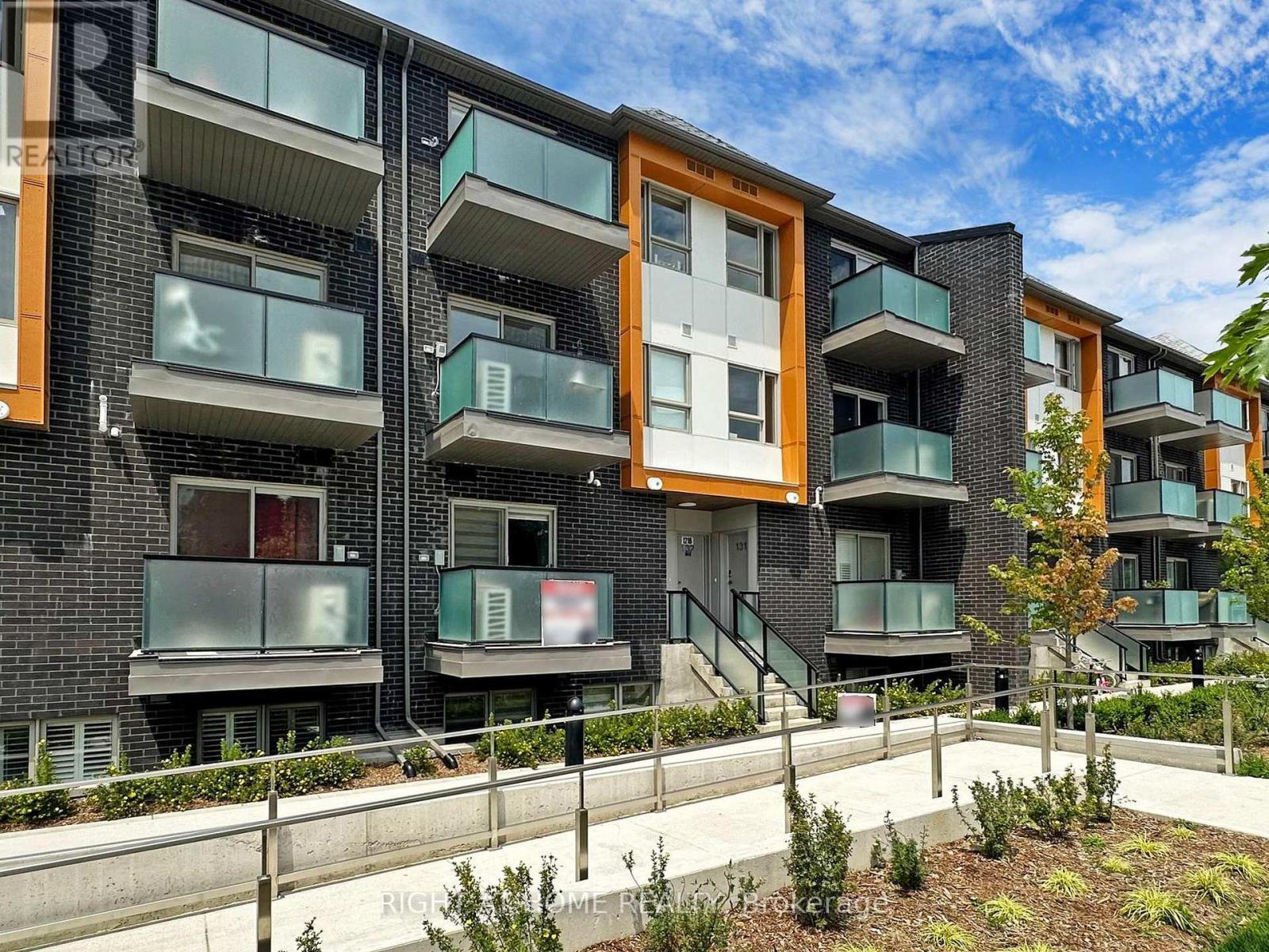 129 - 1081 Danforth Road, Toronto, ON - Outdoor With Balcony With Facade