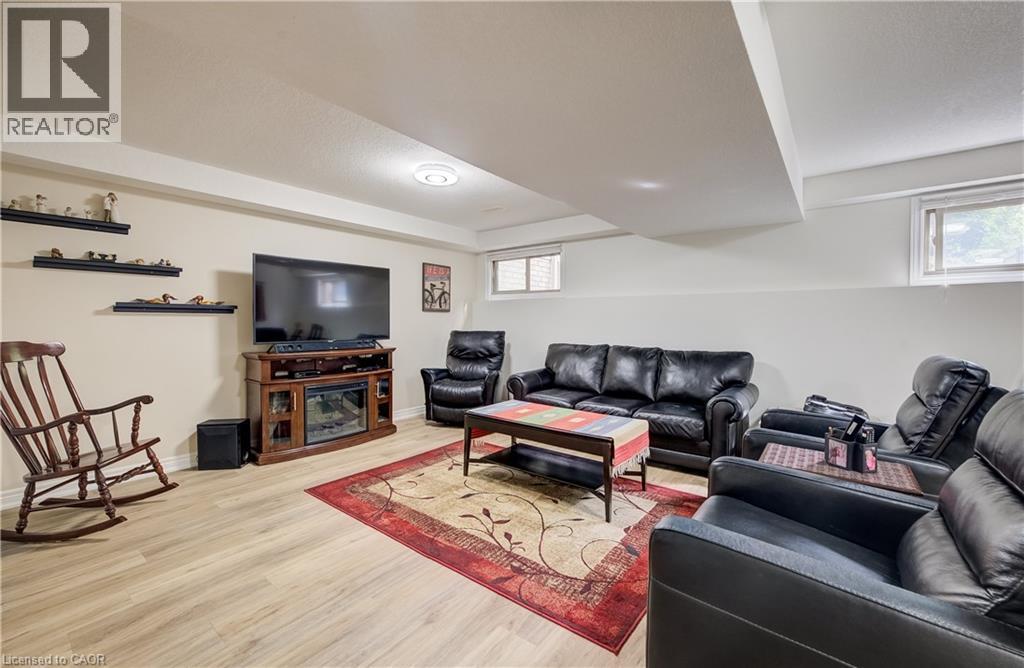 Recessed lighting, wood-finish flooring, and built-in shelving - 16 Steed Court, Brantford, ON