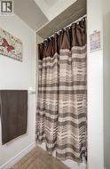 Tiled shower surround with a fabric shower curtain - 