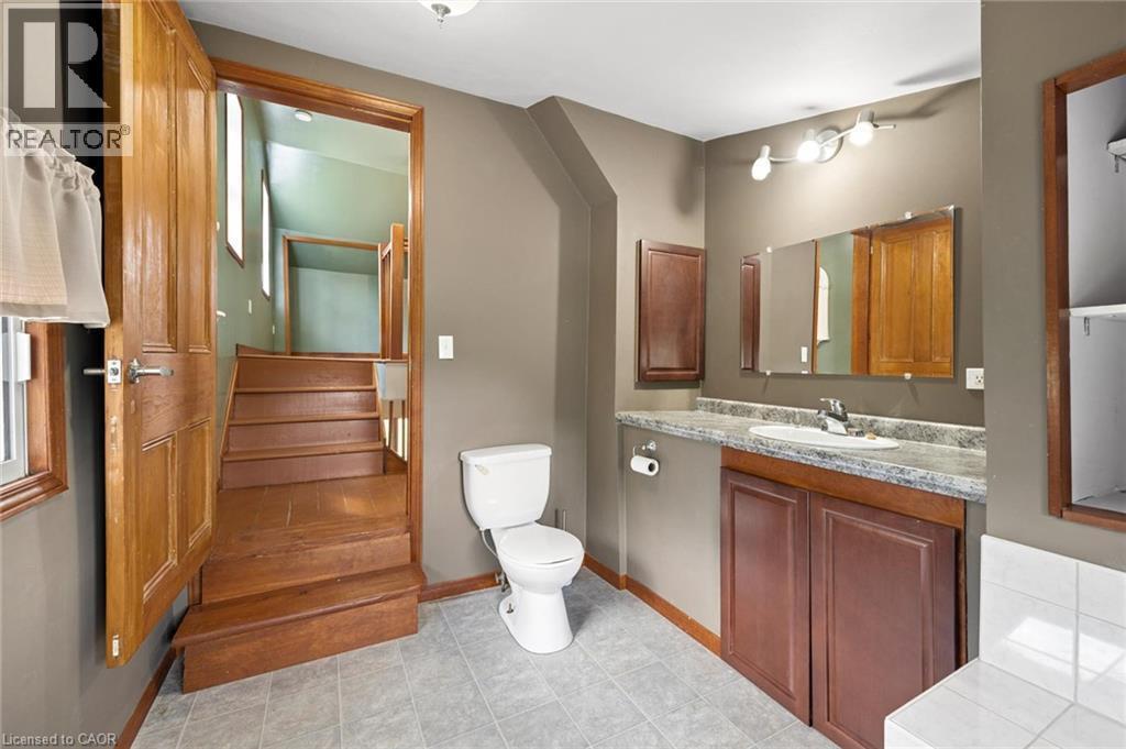 Functional bathroom with a vanity, integrated sink, and overhead lighting - 5480 Line 42 Line, Mitchell, ON