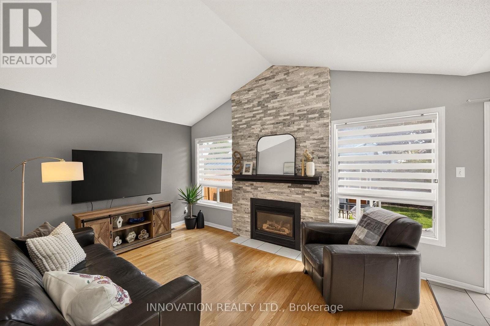 Family room with gas fireplace & cathedral ceiling - 2545 Page Road, Ottawa, ON