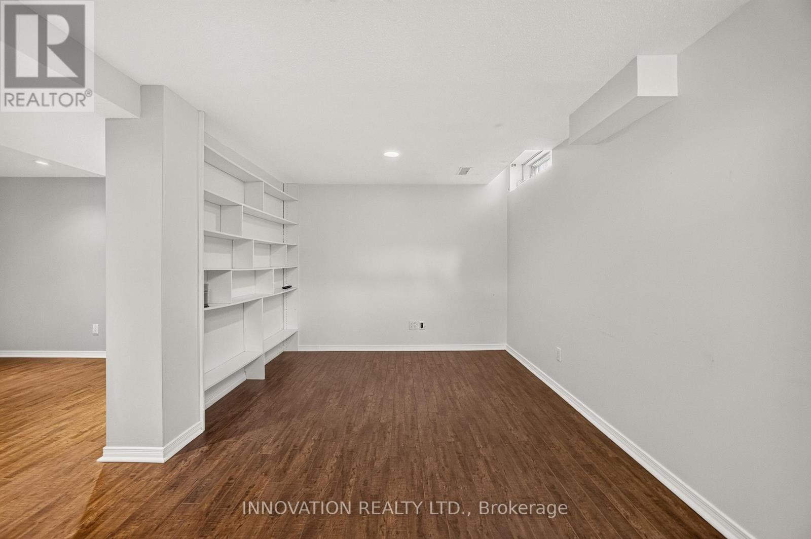 Lower level recreation room with built-in shelving - 2545 Page Road, Ottawa, ON