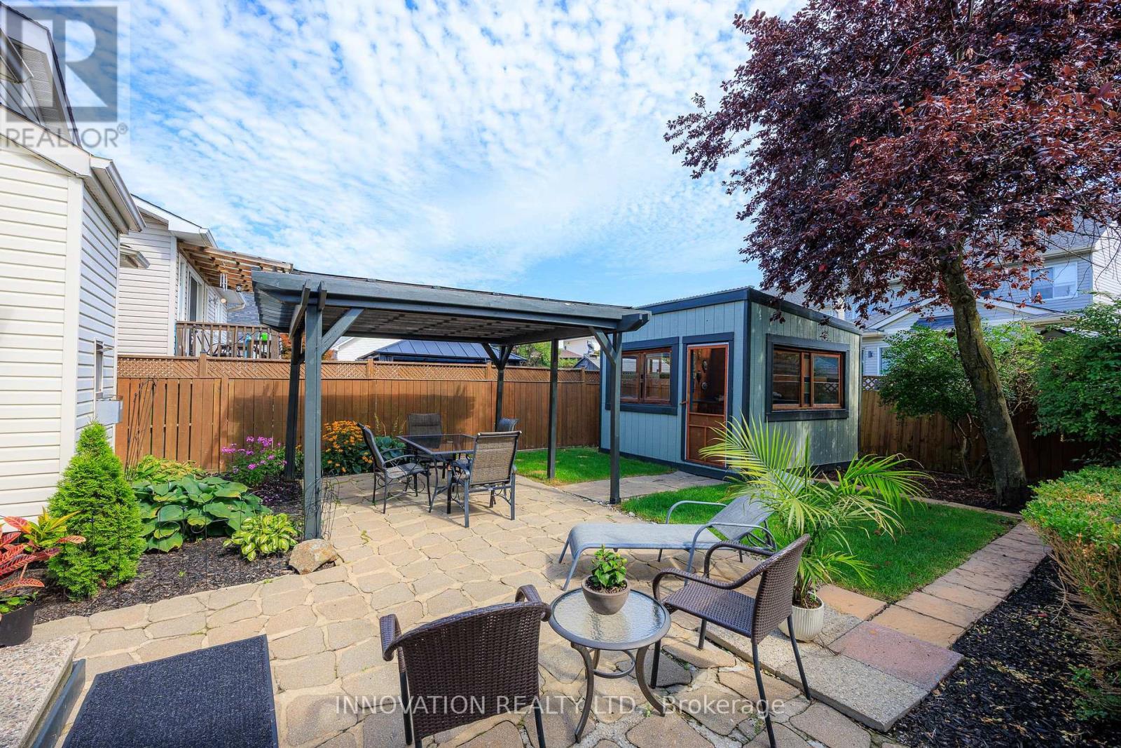 Landscaped backyard patio with pergola & shed - 2545 Page Road, Ottawa, ON