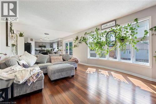 Hardwood-finish flooring, white trim, and multiple windows - 260 Granite Hill Road, Cambridge, ON 