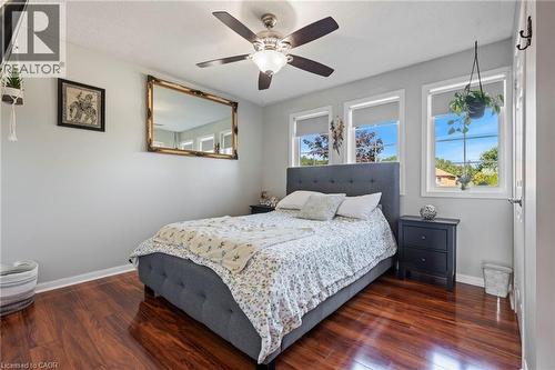 Hardwood flooring, painted walls, ceiling fan with integrated lighting, and multiple windows - 260 Granite Hill Road, Cambridge, ON 