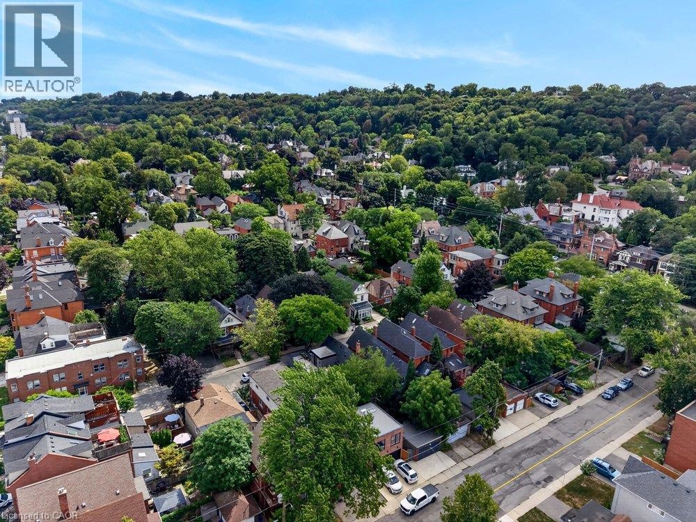 Residential neighborhood featuring extensive mature tree canopy and varied architectural styles - 16 Bruce Street, Hamilton, ON