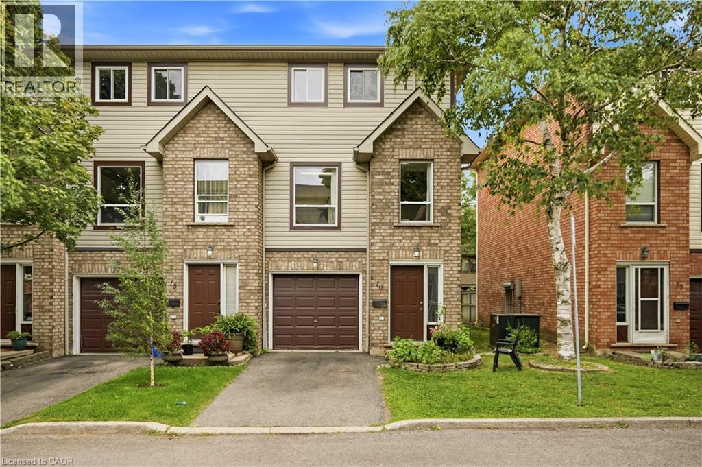 Brick and siding exterior with a peaked entry, attached garage, and a paved driveway - 384 Limeridge Road E Unit# 16, Hamilton, ON
