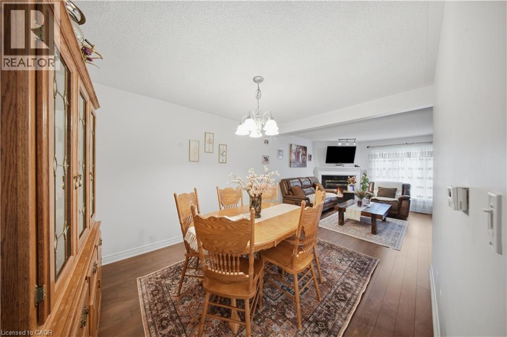 Wood-finish flooring throughout, white wall finishes, and recessed lighting - 384 Limeridge Road E Unit# 16, Hamilton, ON