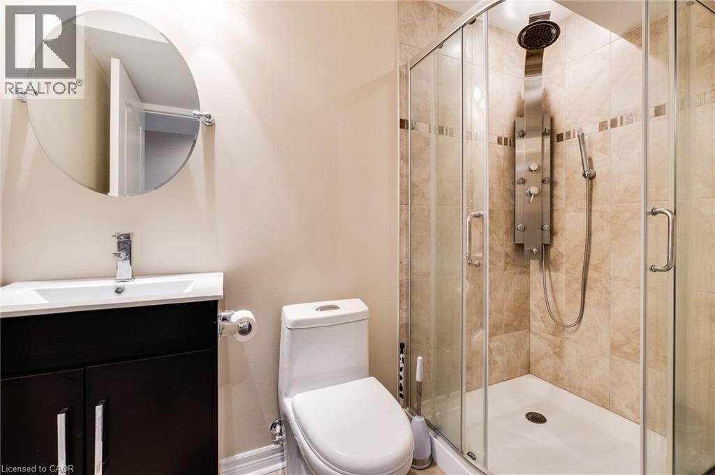 Glass-enclosed shower with a multi-function shower panel - 2 Hawstone Road, Vellore, ON