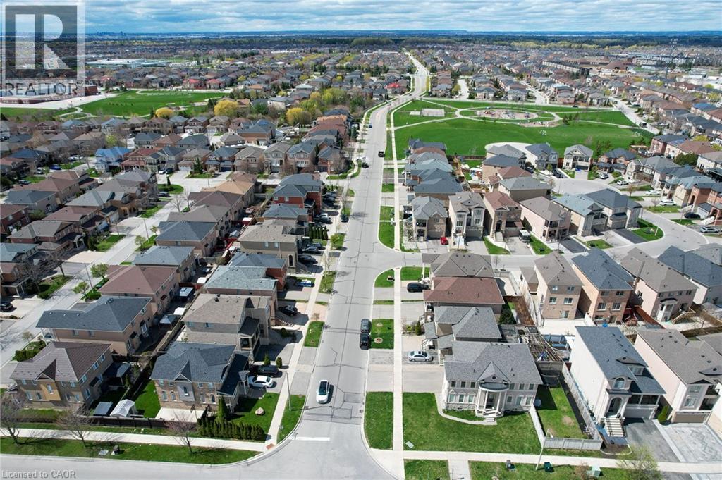 Residential street with paved roads, concrete sidewalks, and manicured lawns - 2 Hawstone Road, Vellore, ON