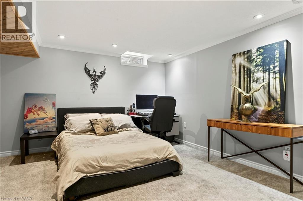 Recessed lighting, crown molding, wood-finish ceiling accent, wall-to-wall carpeting, and a built-in window - 31 Grindstone Way, Hamilton, ON