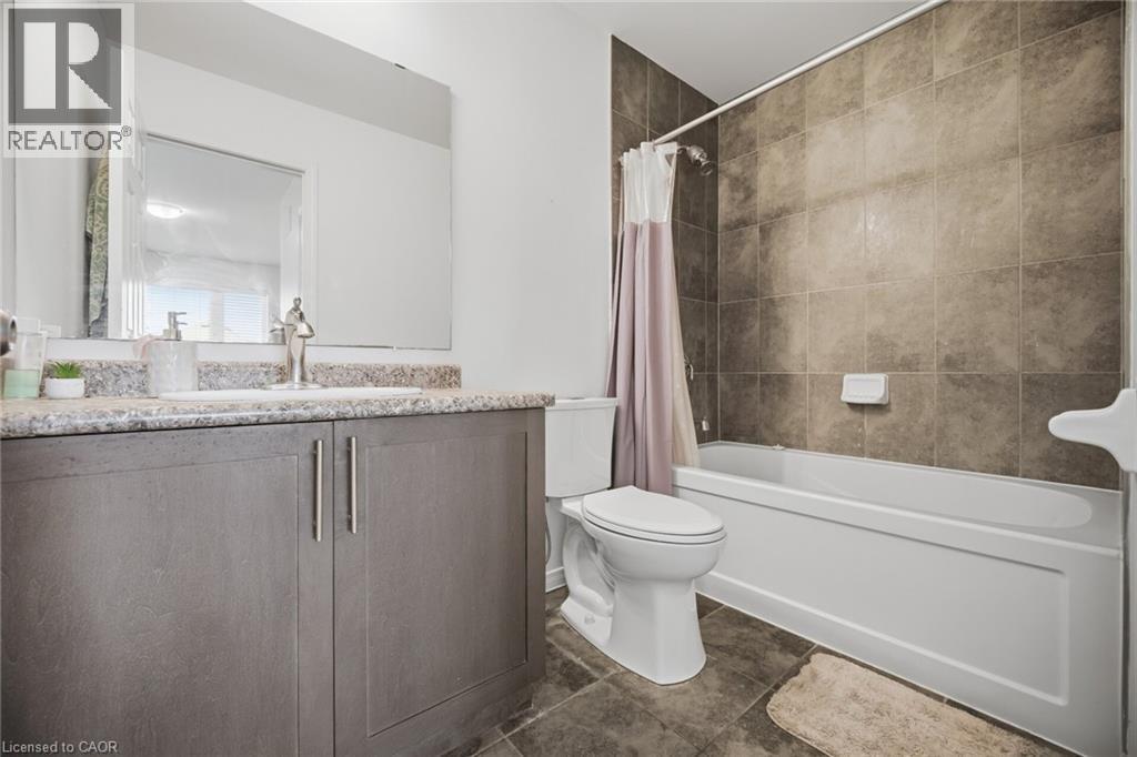 Vanity with a light-colored countertop, undermount sink, and polished chrome faucet - 135 Hardcastle Drive Unit# 85, Cambridge, ON