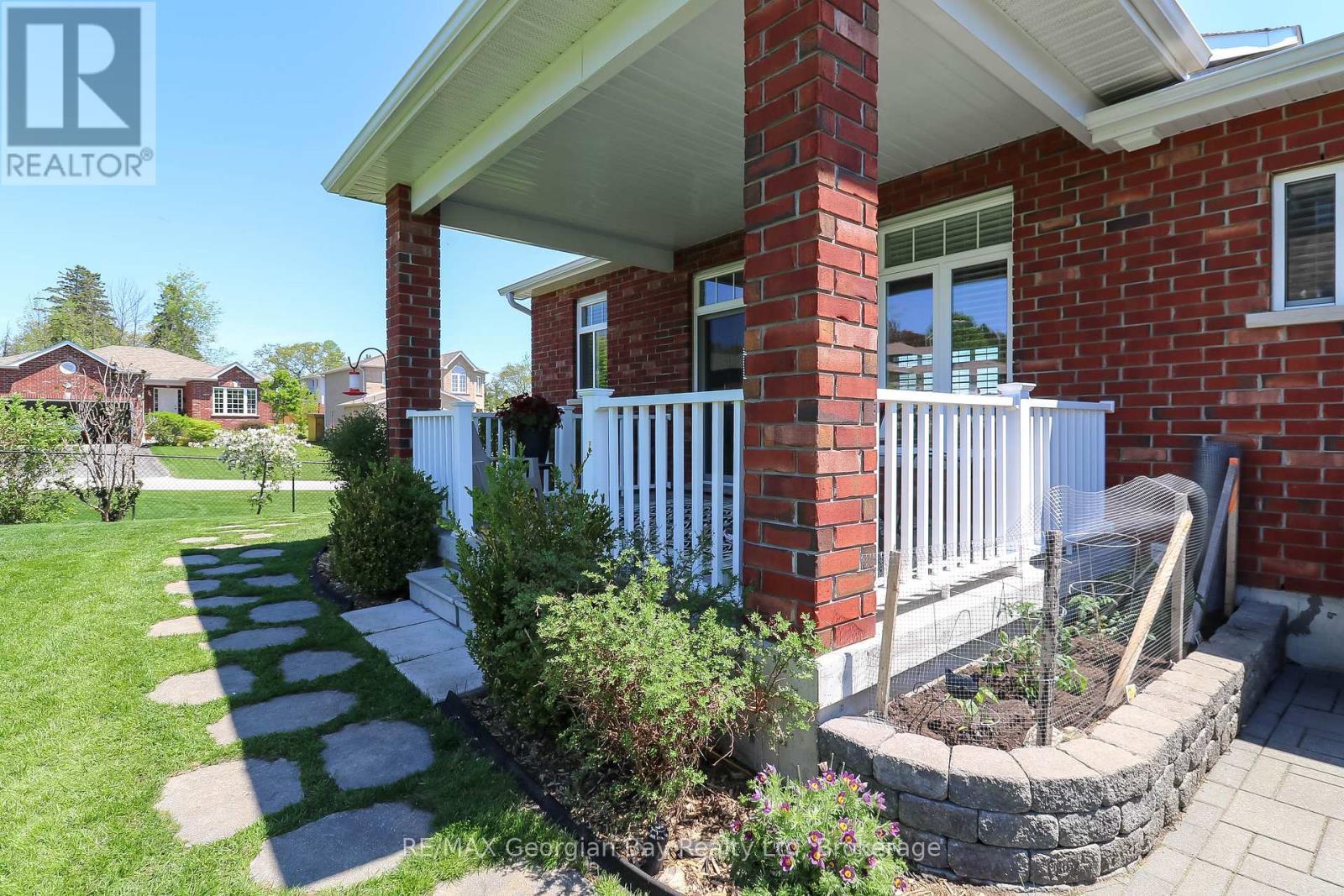 COVERED DECK OFF KITCHEN - 936 Jordeli Lane, Midland, ON