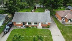 Paved Drive goes up side of house park 4 - 