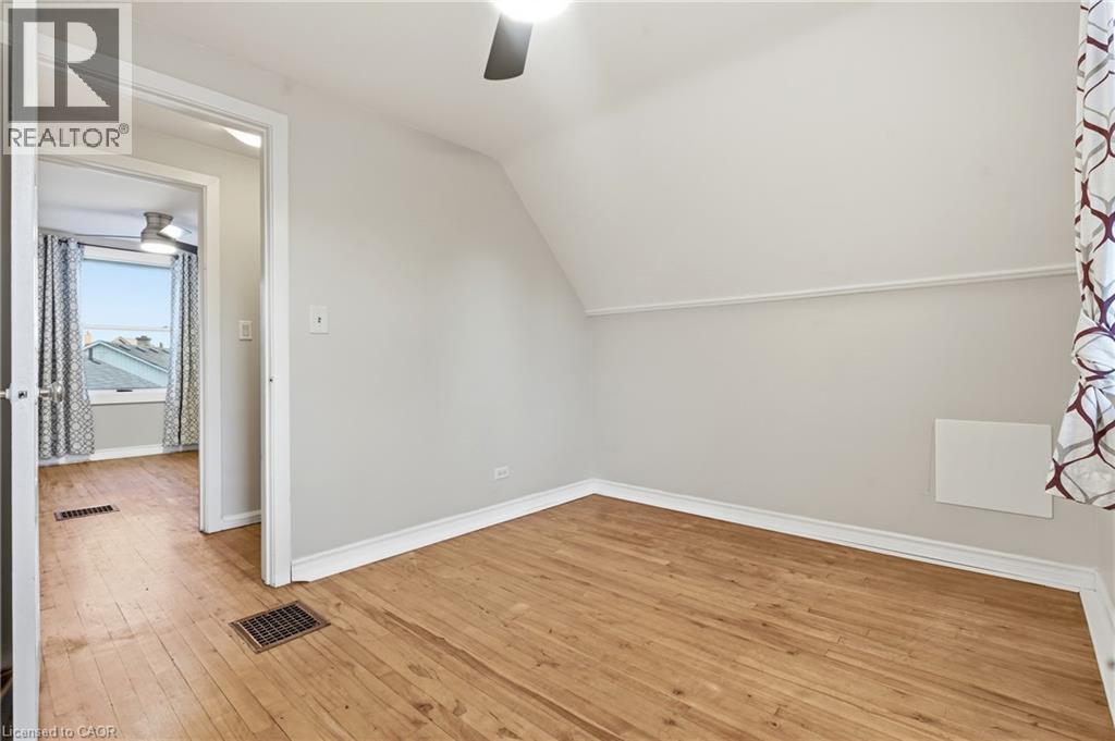 Wood-finish flooring with white trim - 160 Lorne Crescent, Kitchener, ON