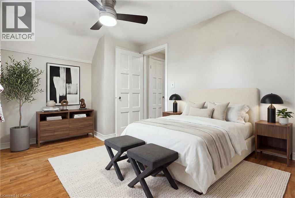 Hardwood flooring, sloped ceiling, panel doors, ceiling fan, and built-in lighting - 160 Lorne Crescent, Kitchener, ON