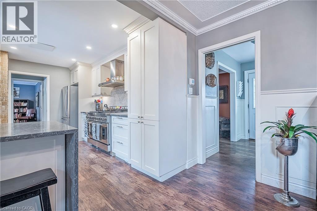 Intersection of kitchen, dining room, looking towards the front foyer. - 115 Southwood Drive, Cambridge, ON